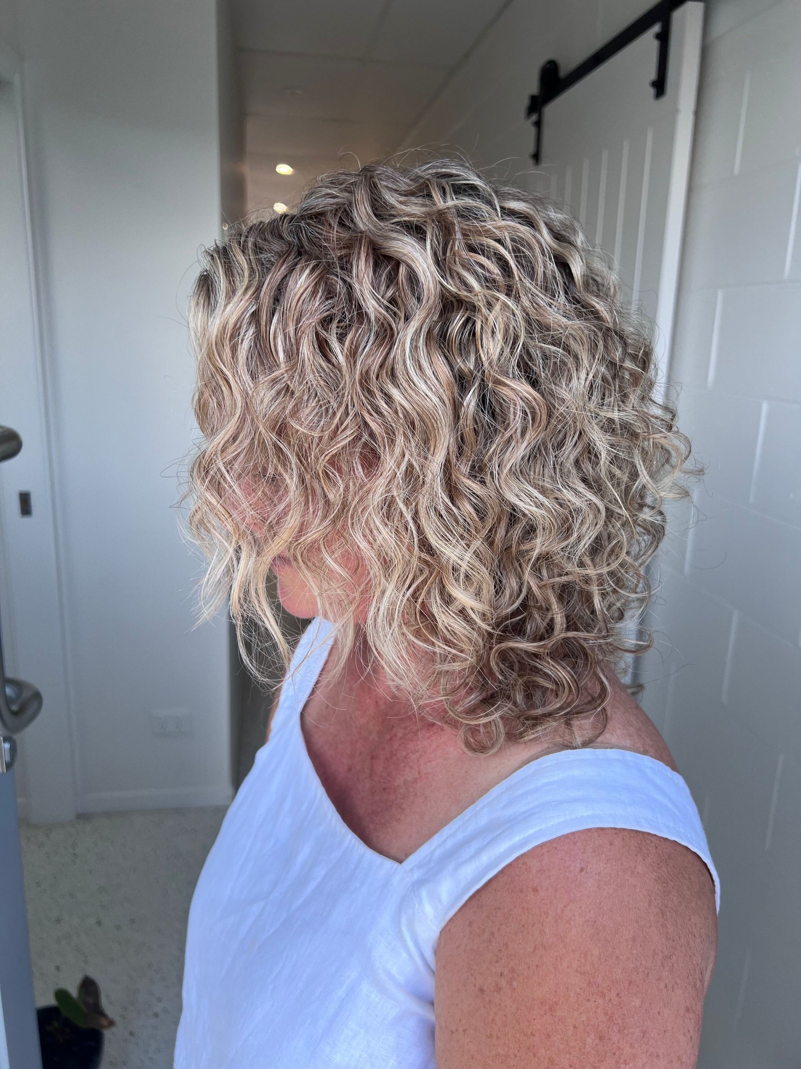 Curly hair cut and styling work at About Hair Mackay, example 1